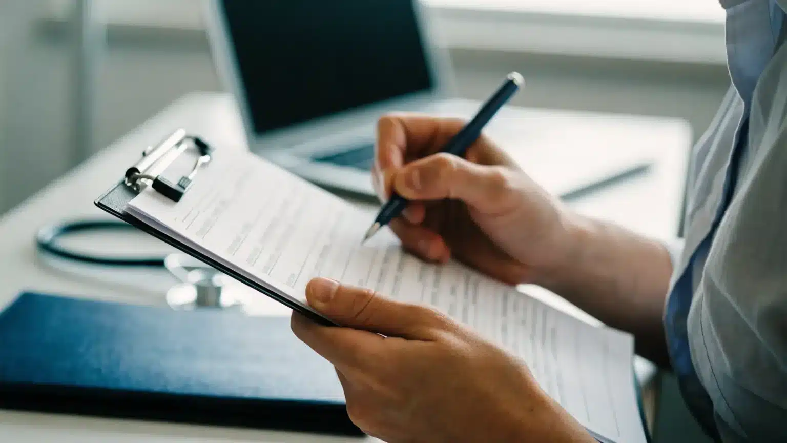 A health center administrator checks items on a printed board checklist on a clipboard